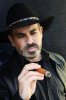 cutcaster-photo-100439893-Bearded-man-smoking-cigar.jpg